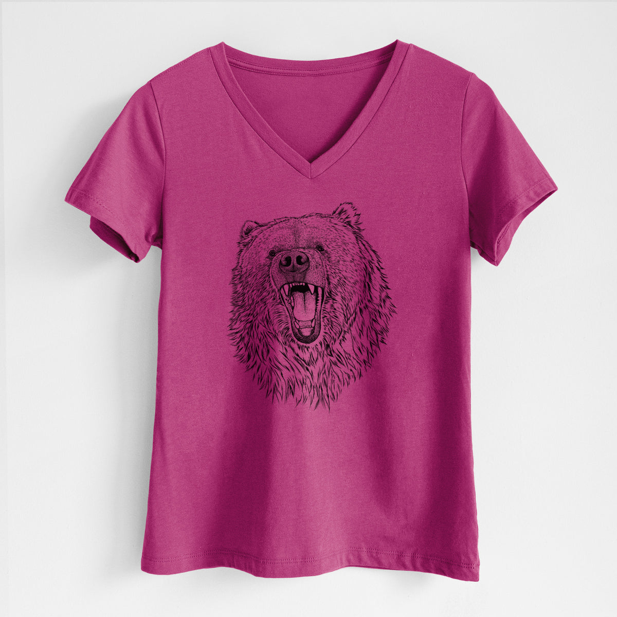 Berry pink women's relaxed fit cotton V-neck t-shirt laid flat, printed with a detailed black ink portrait of a roaring Kodiak bear facing forward.