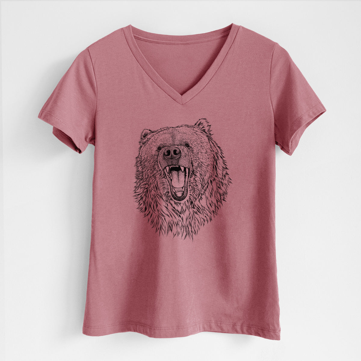 Mauve pink women's relaxed fit cotton V-neck t-shirt laid flat, printed with a detailed black ink portrait of a roaring Kodiak bear facing forward.