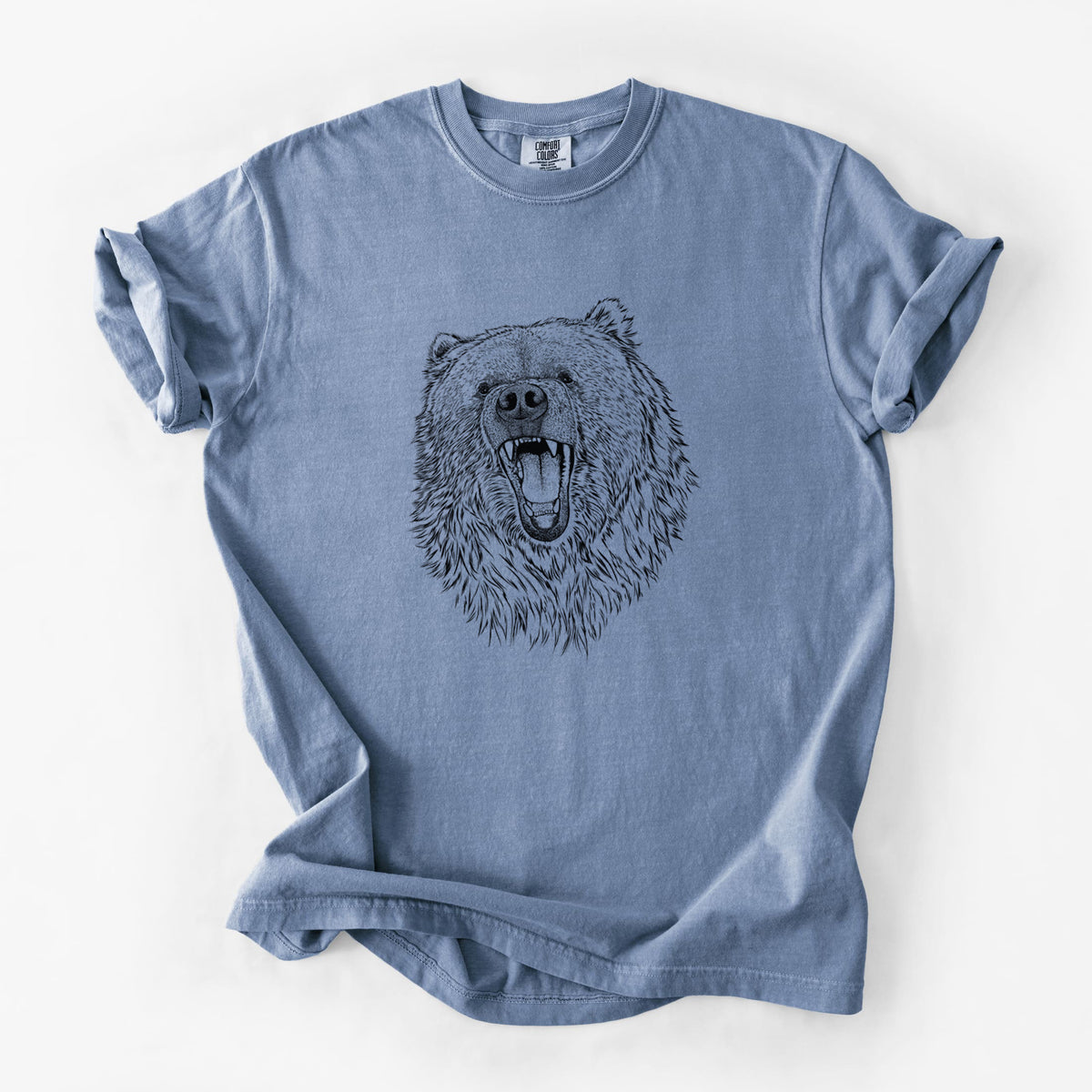 Blue jean Comfort Colors t-shirt laid flat, printed with a detailed black ink portrait of a roaring Kodiak bear facing forward.