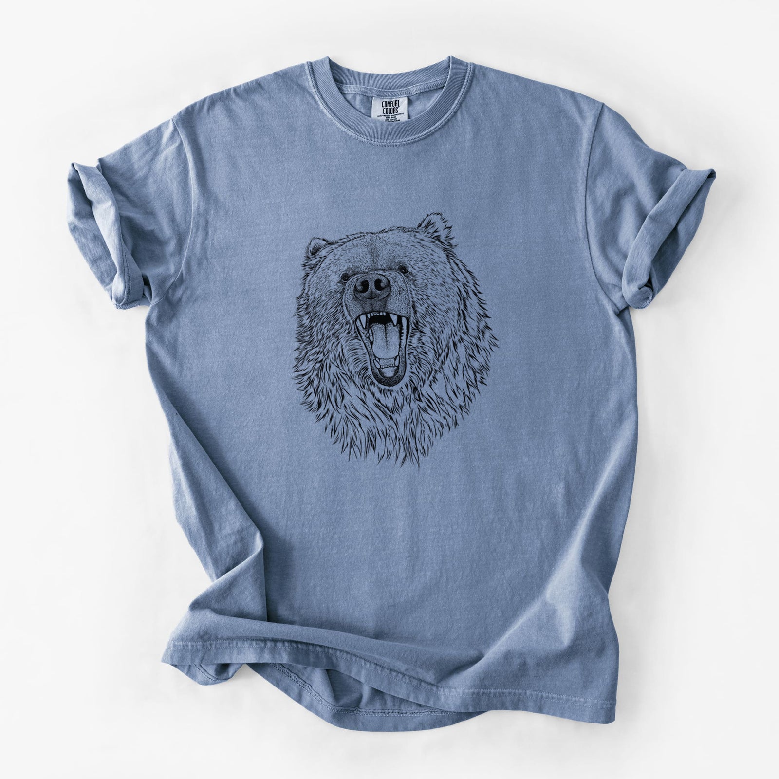 Blue jean Comfort Colors t-shirt laid flat, printed with a detailed black ink portrait of a roaring Kodiak bear facing forward.