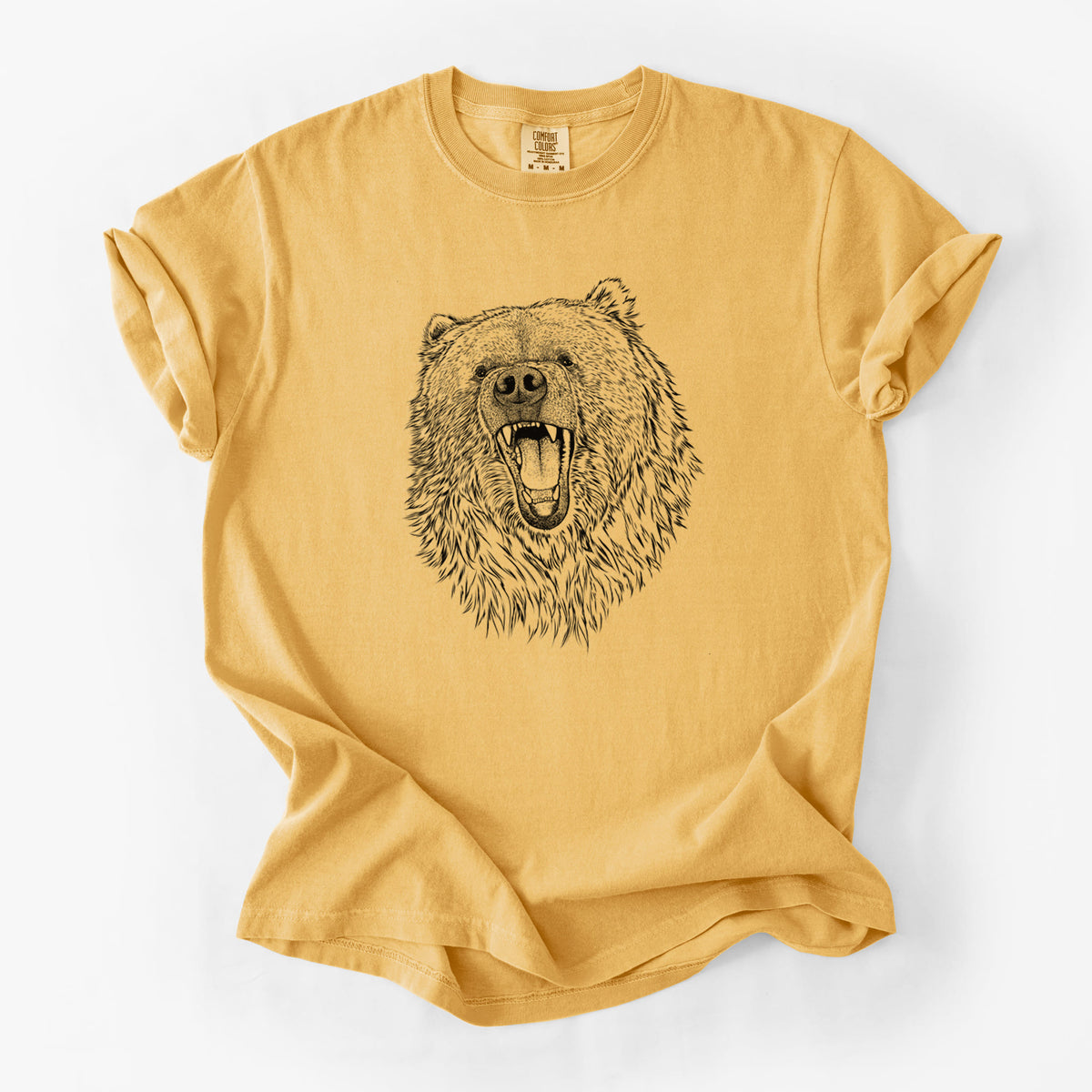 Golden wheat yellow Comfort Colors t-shirt laid flat, printed with a detailed black ink portrait of a roaring Kodiak bear facing forward.