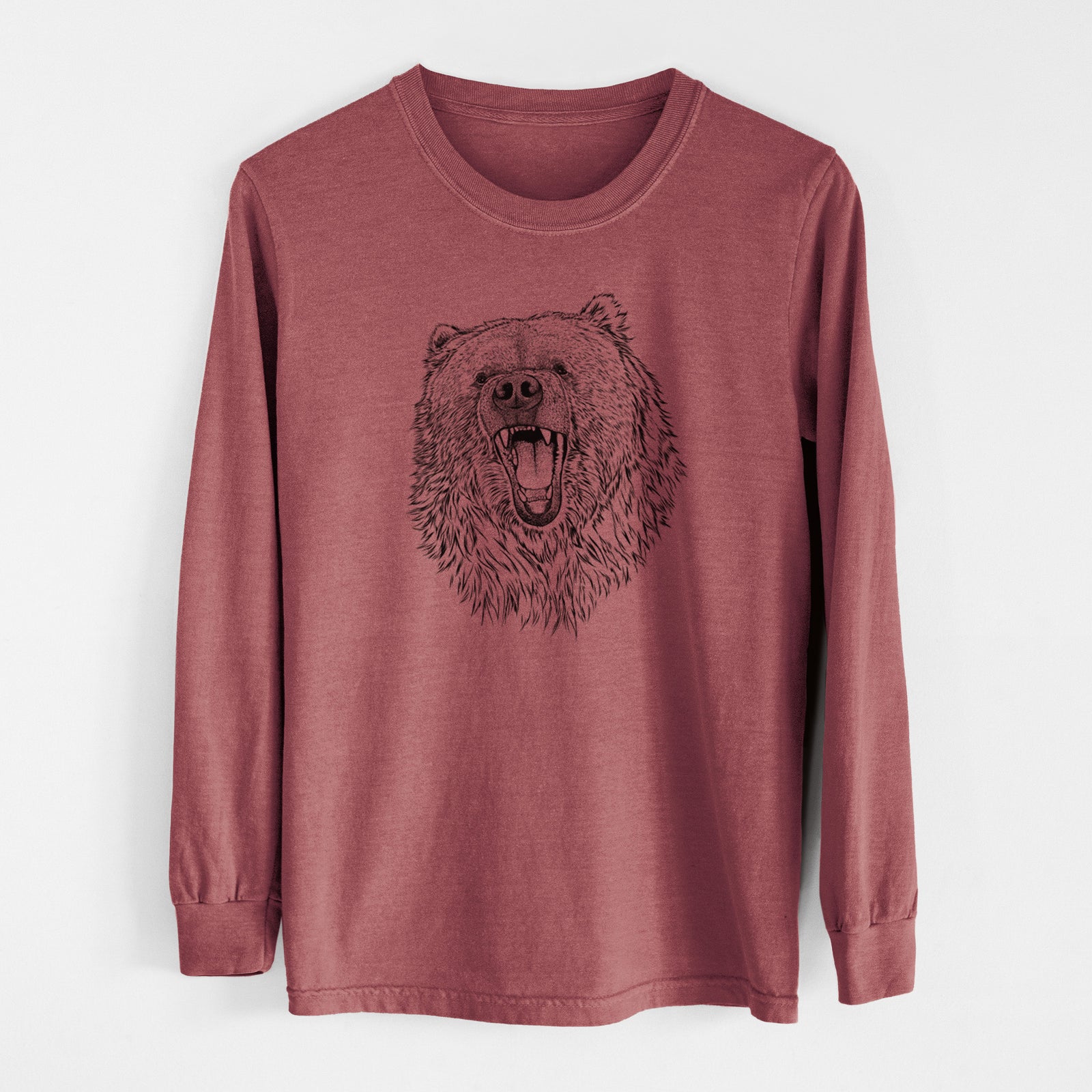 Ivory Comfort Colors long sleeve shirt laid flat, printed with a detailed black ink portrait of a roaring Kodiak bear facing forward.