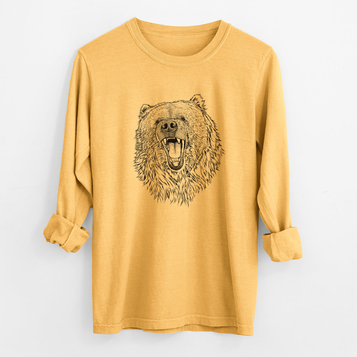 Golden wheat yellow Comfort Colors long sleeve shirt laid flat with the cuffs rolled, printed with a detailed black ink portrait of a roaring Kodiak bear facing forward.