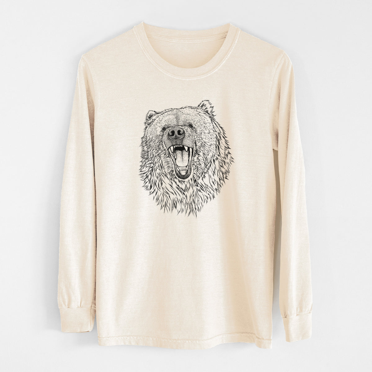 Ivory Comfort Colors long sleeve shirt laid flat, printed with a detailed black ink portrait of a roaring Kodiak bear facing forward.