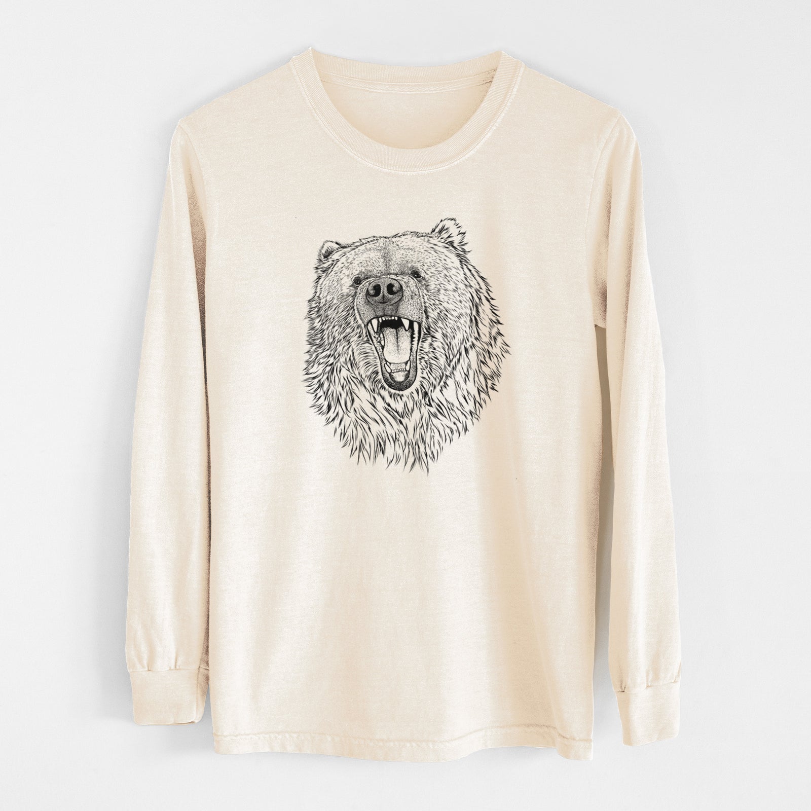 Ivory Comfort Colors long sleeve shirt laid flat, printed with a detailed black ink portrait of a roaring Kodiak bear facing forward.