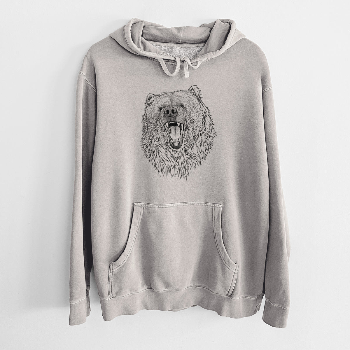 Cement grey pigment dyed hoodie laid flat, printed with a detailed black ink portrait of a roaring Kodiak bear facing forward.