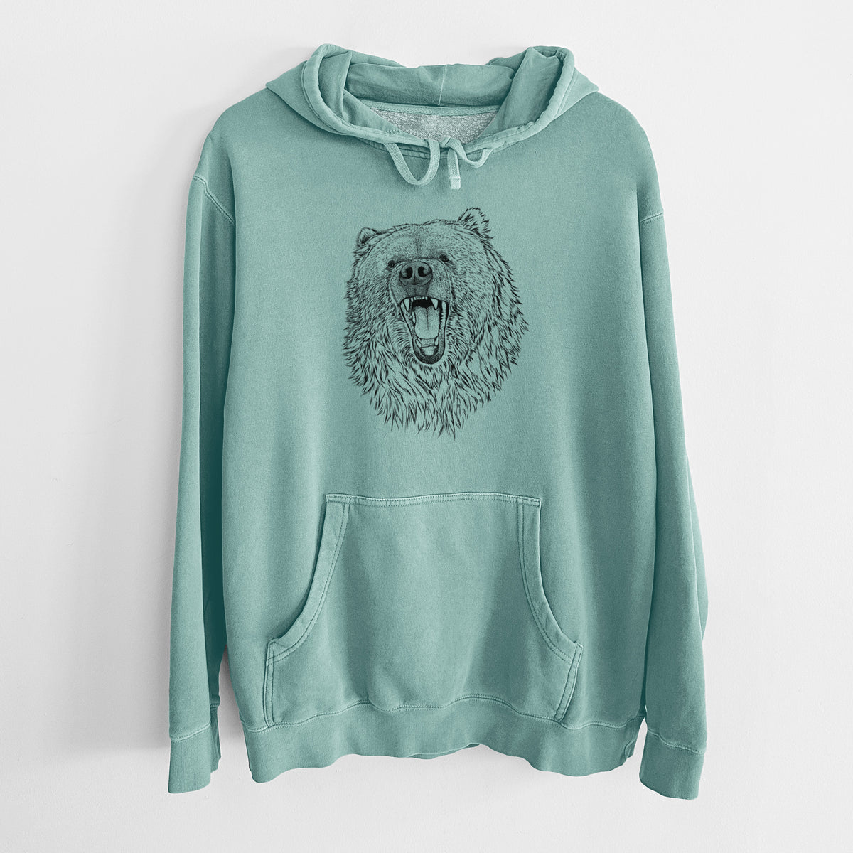 Mint green pigment dyed hoodie laid flat, printed with a detailed black ink portrait of a roaring Kodiak bear facing forward.