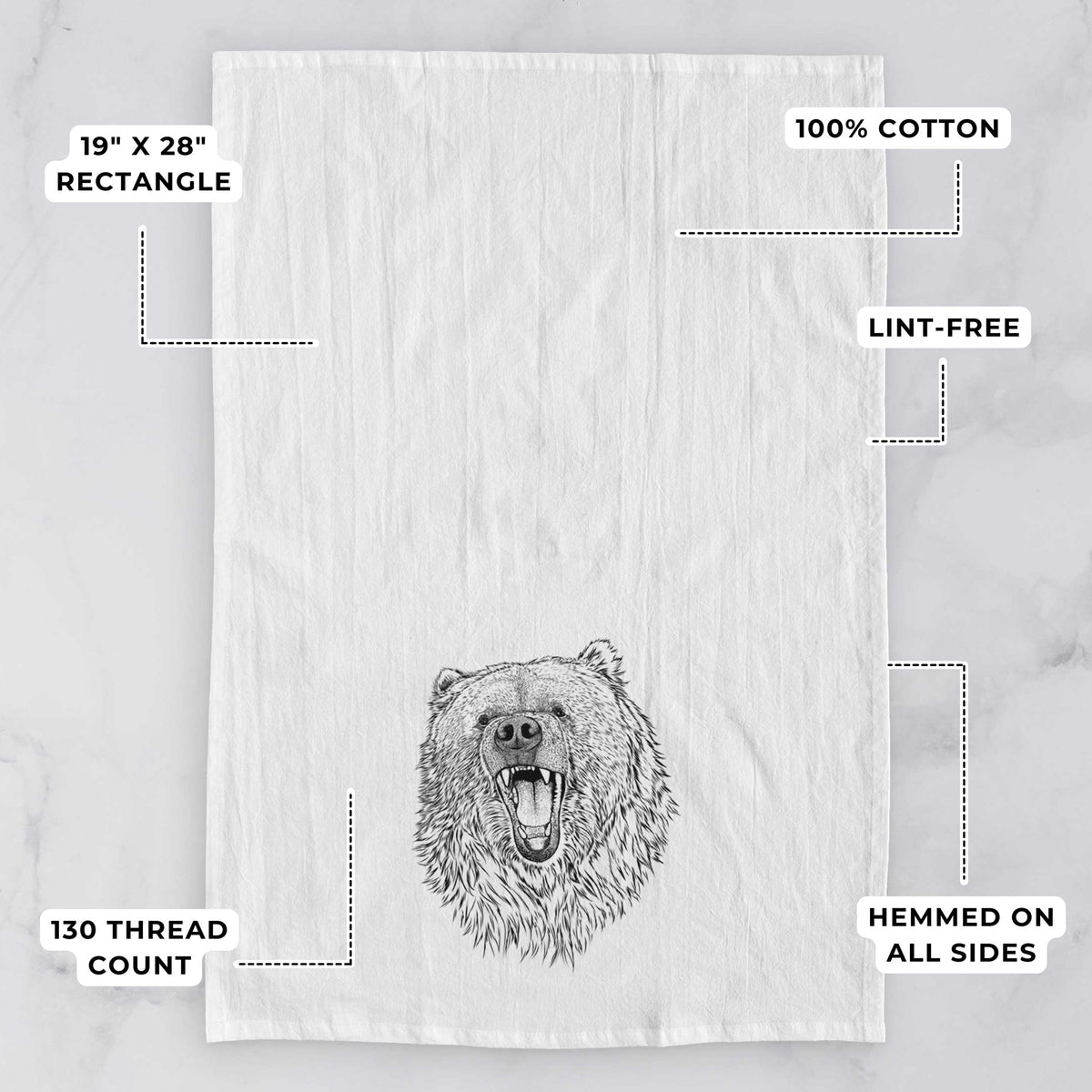 White tea towel printed with a detailed black ink portrait of a roaring Kodiak bear facing forward, with feature labels: 19 by 28 inch rectangle, 100% cotton, lint-free, 130 thread count, hemmed on all sides.