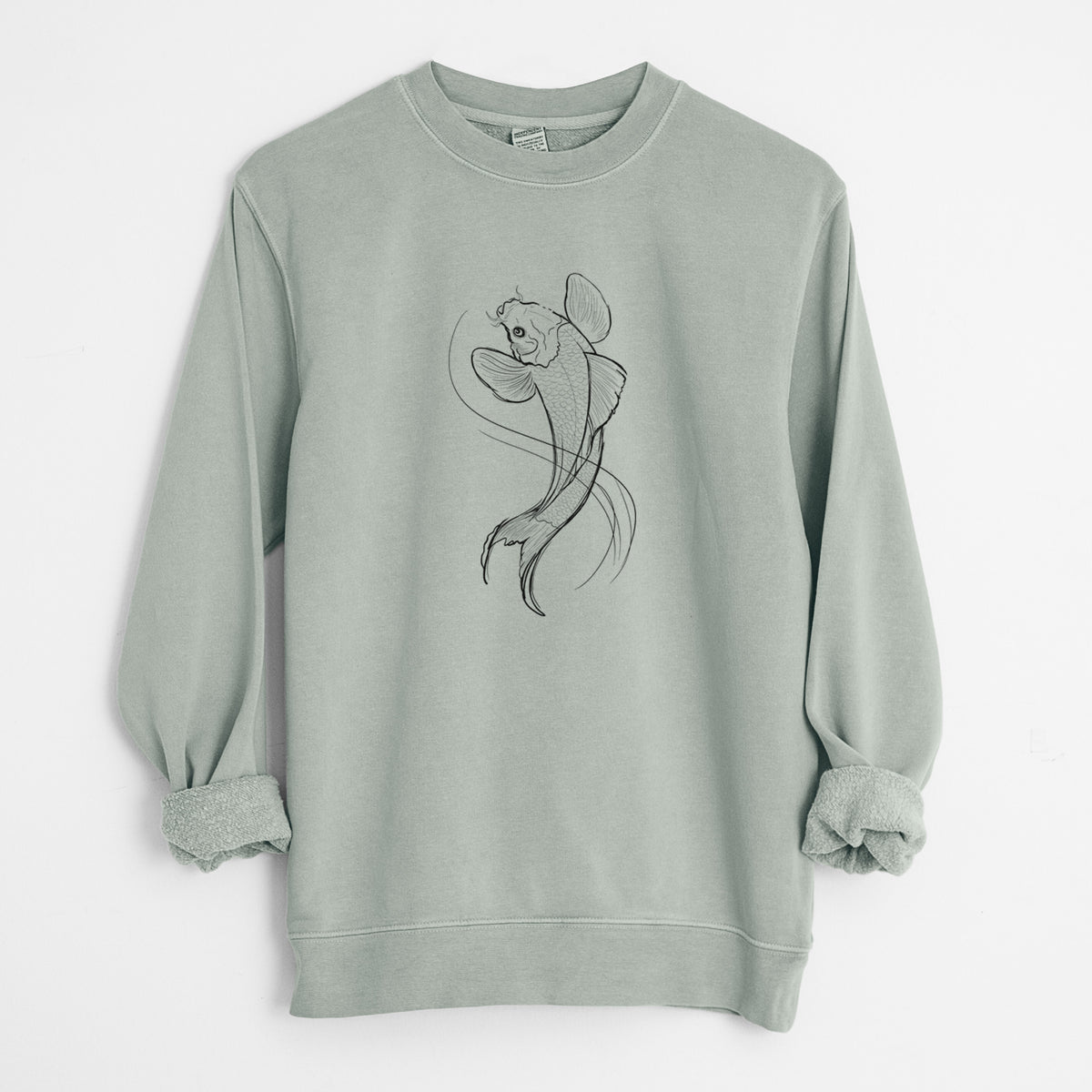 Sage green pigment dyed crewneck sweatshirt laid flat with the sleeves rolled, printed with a black ink line drawing of a koi fish swimming with flowing fins.