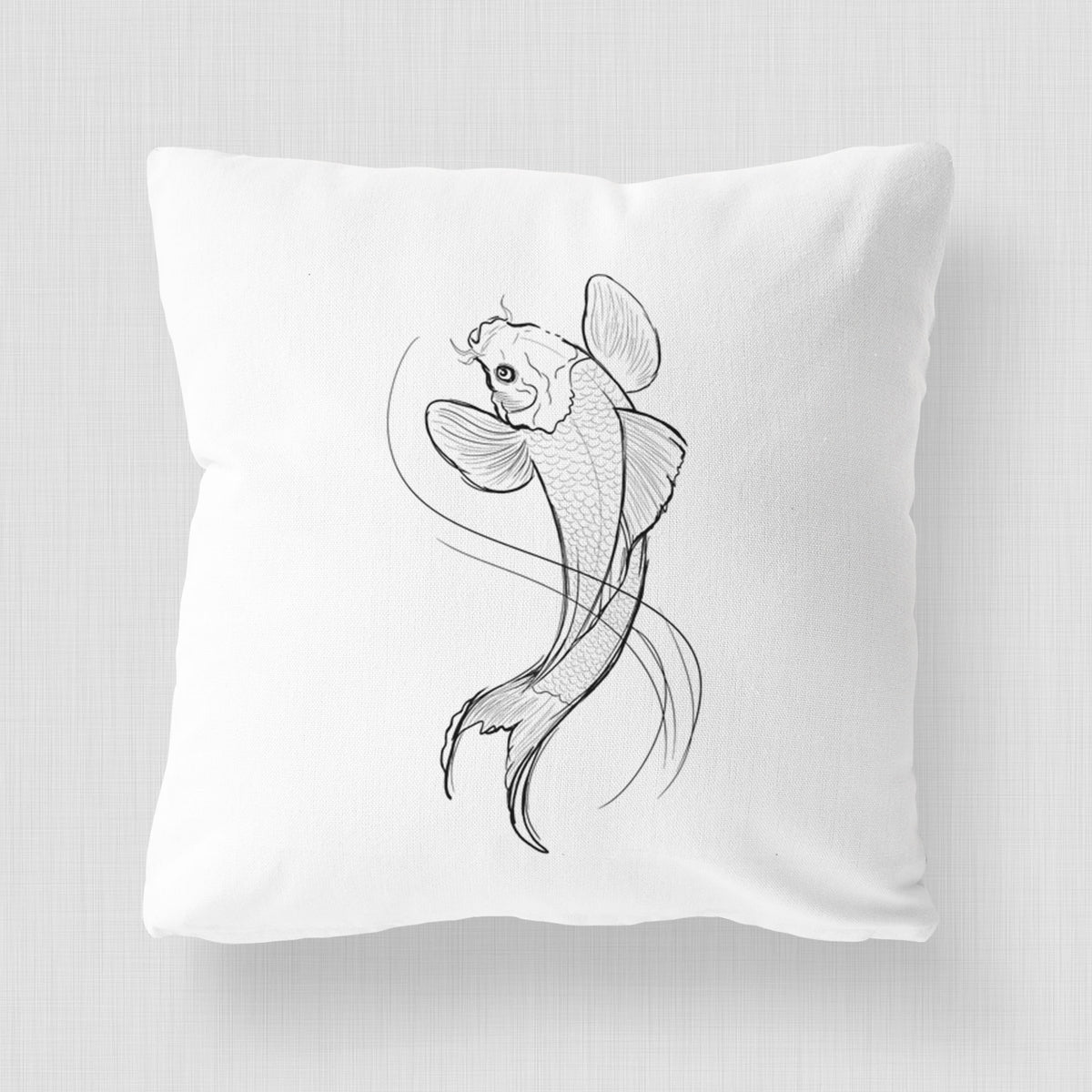 White pillow cover printed with a black ink line drawing of a koi fish swimming with flowing fins.