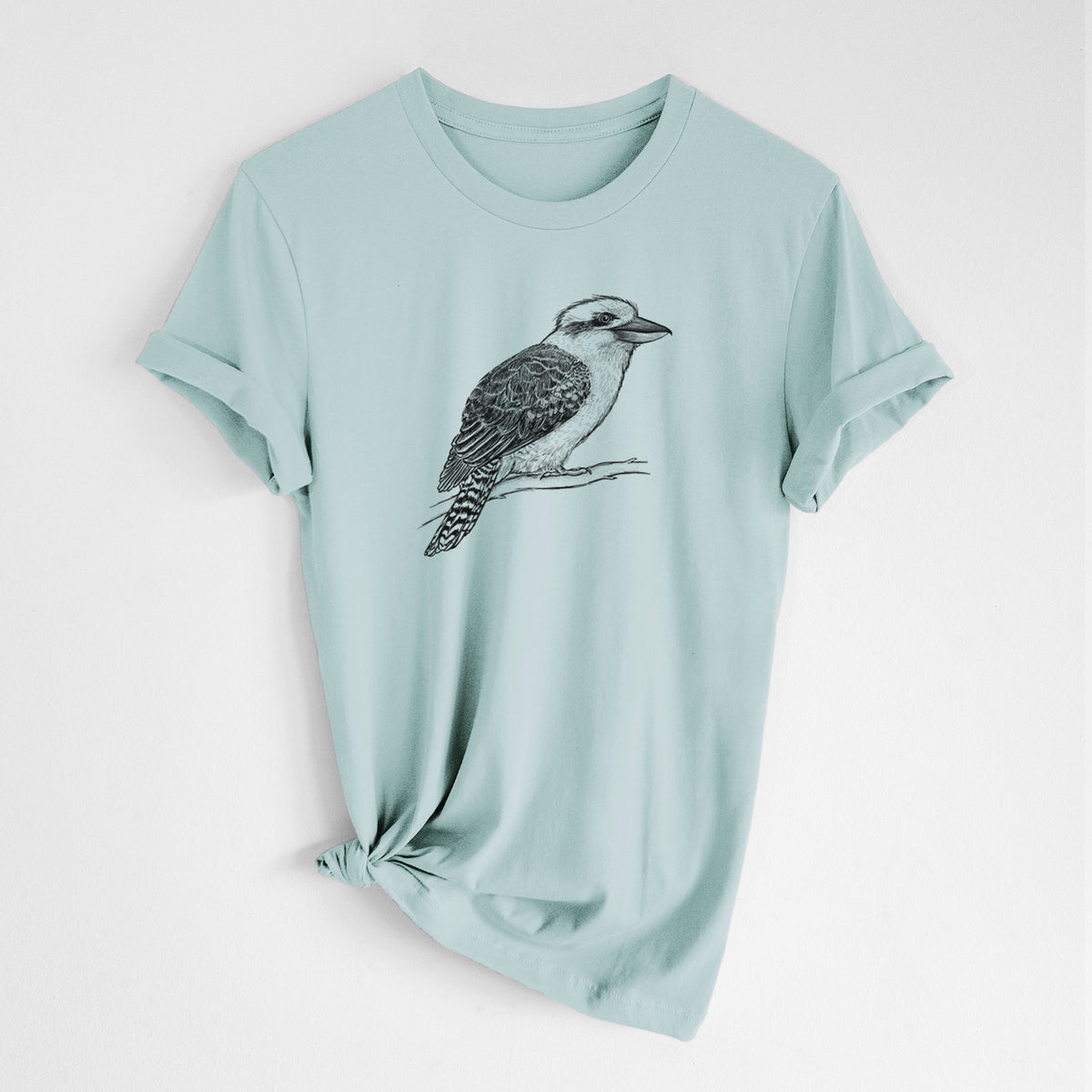 Dusty blue lightweight cotton t-shirt laid flat with the sleeves rolled, printed with a detailed black ink sketch of a kookaburra perched on a branch.
