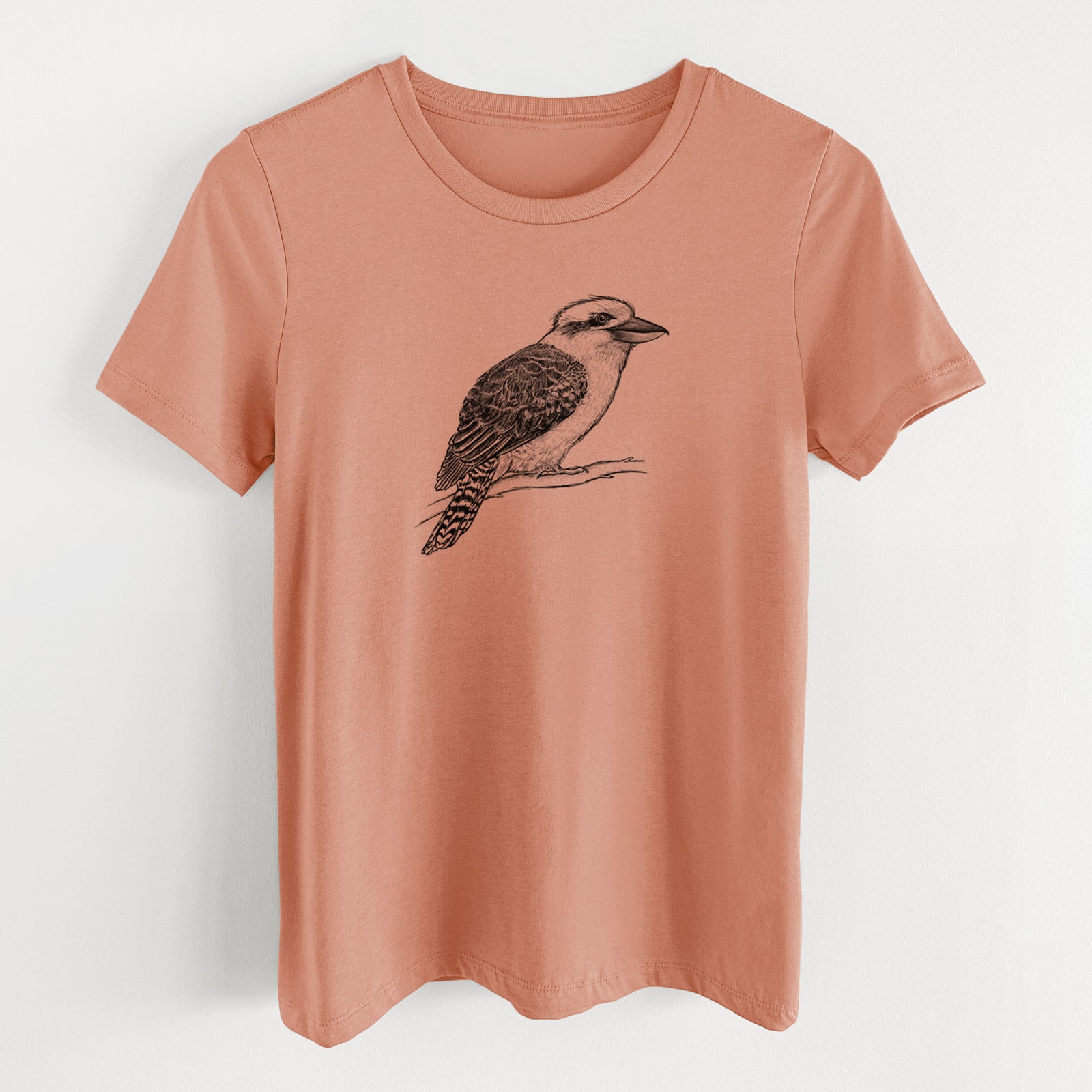 Terracotta orange women's relaxed fit cotton t-shirt laid flat, printed with a detailed black ink sketch of a kookaburra perched on a branch.