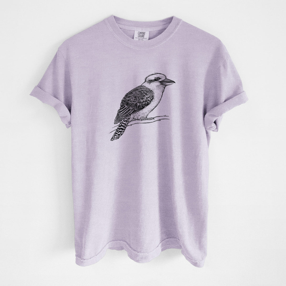 Orchid purple Comfort Colors t-shirt laid flat, printed with a detailed black ink sketch of a kookaburra perched on a branch.