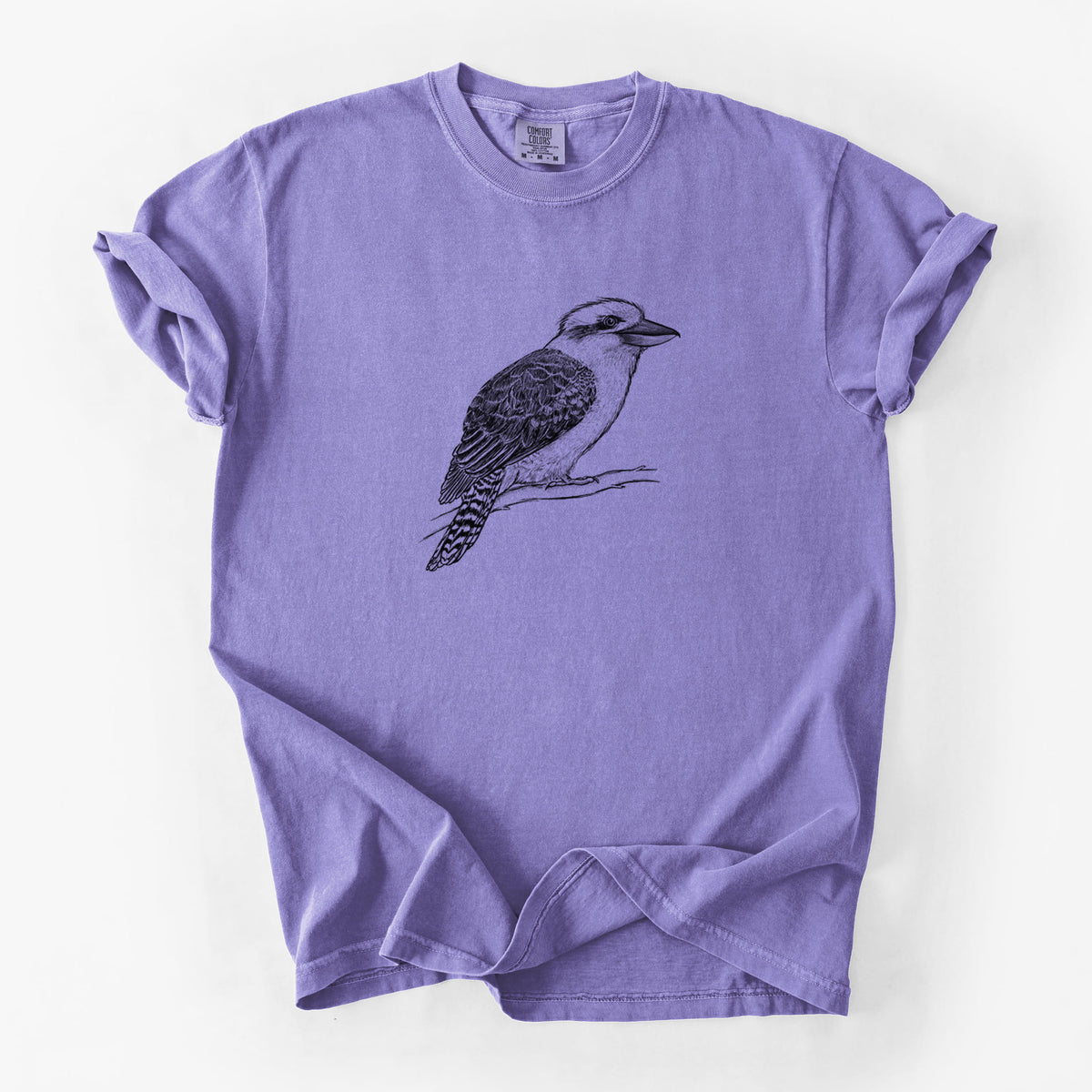 Violet purple Comfort Colors t-shirt laid flat, printed with a detailed black ink sketch of a kookaburra perched on a branch.