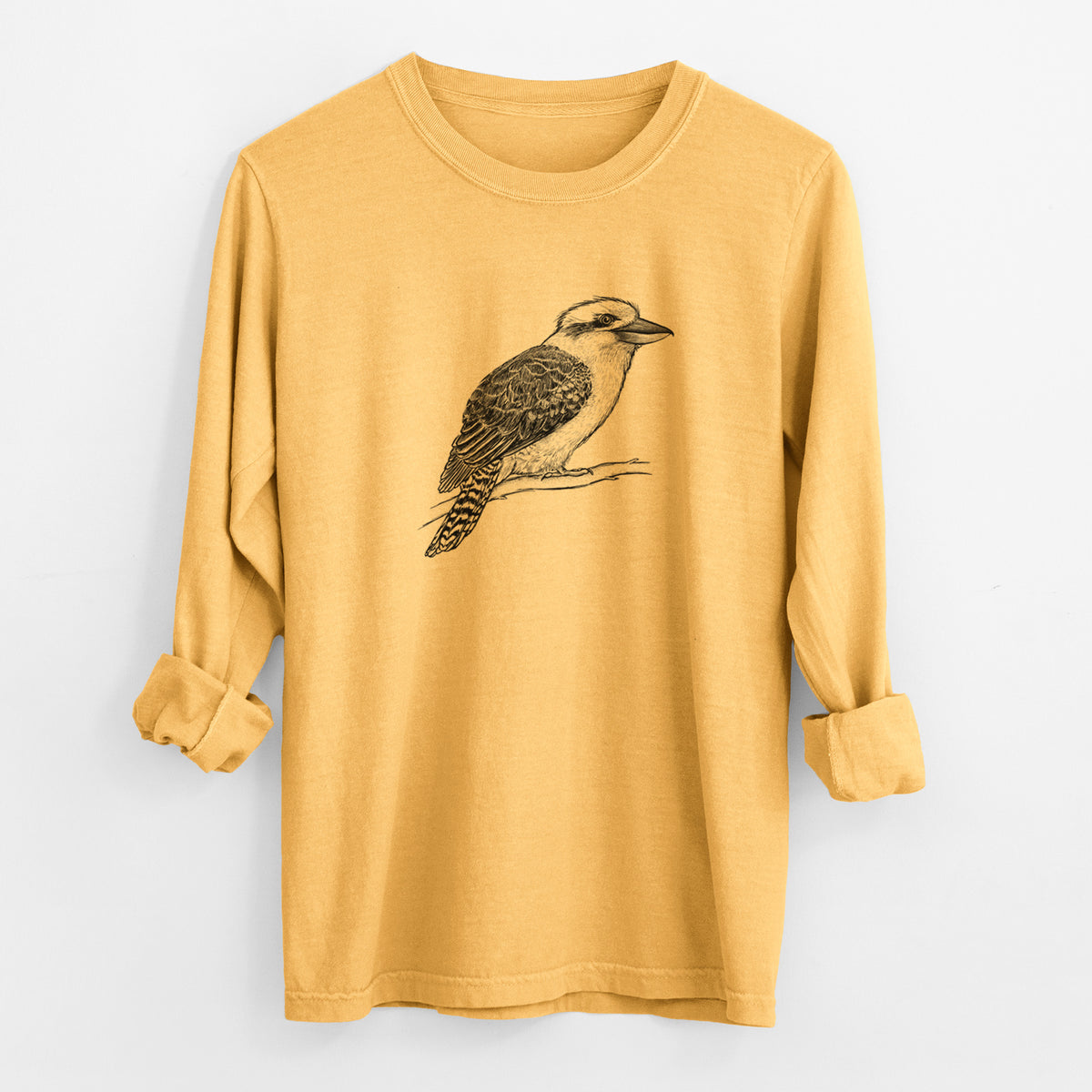 Golden wheat yellow Comfort Colors long sleeve shirt laid flat with the cuffs rolled, printed with a detailed black ink sketch of a kookaburra perched on a branch.