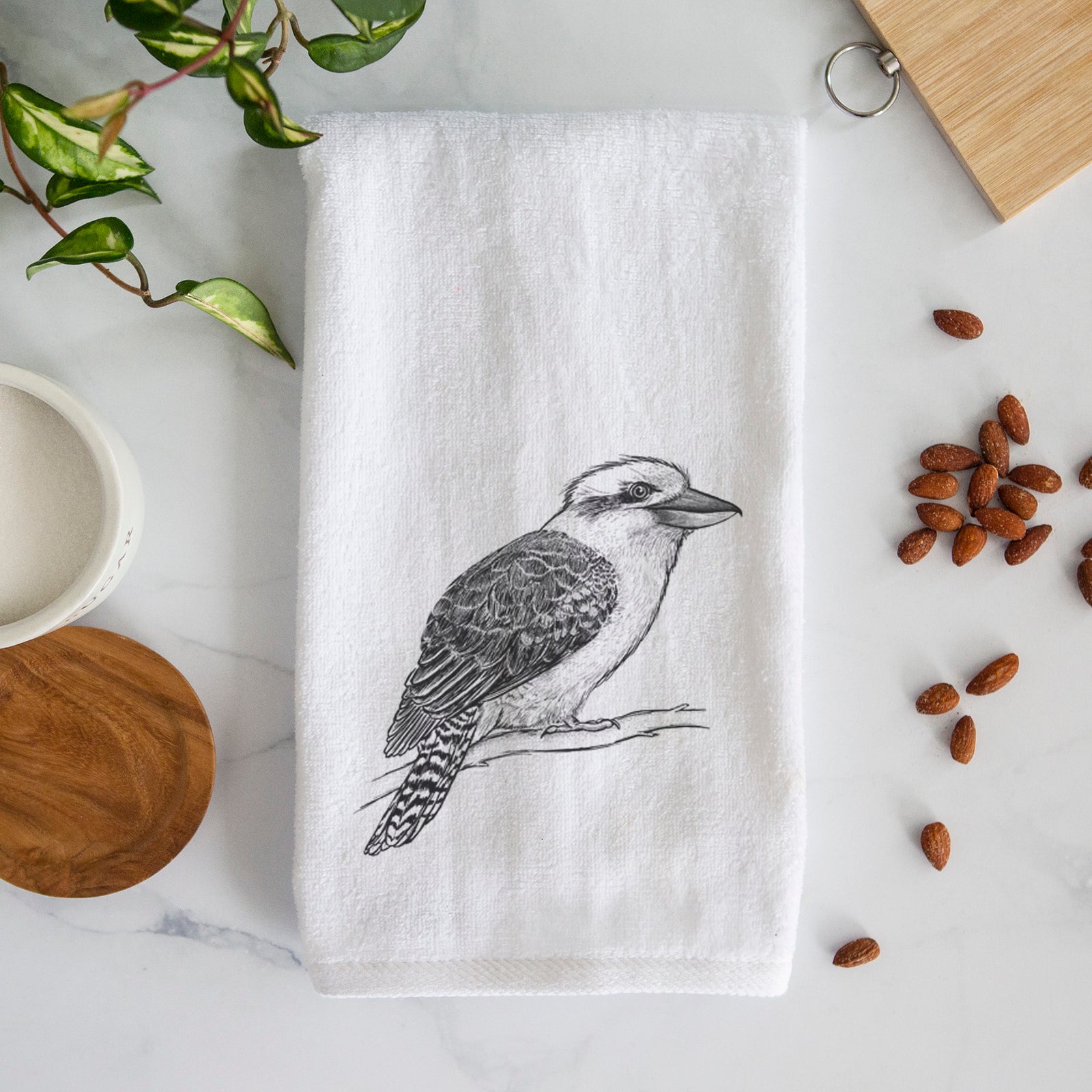 White hand towel printed with a detailed black ink sketch of a kookaburra perched on a branch.