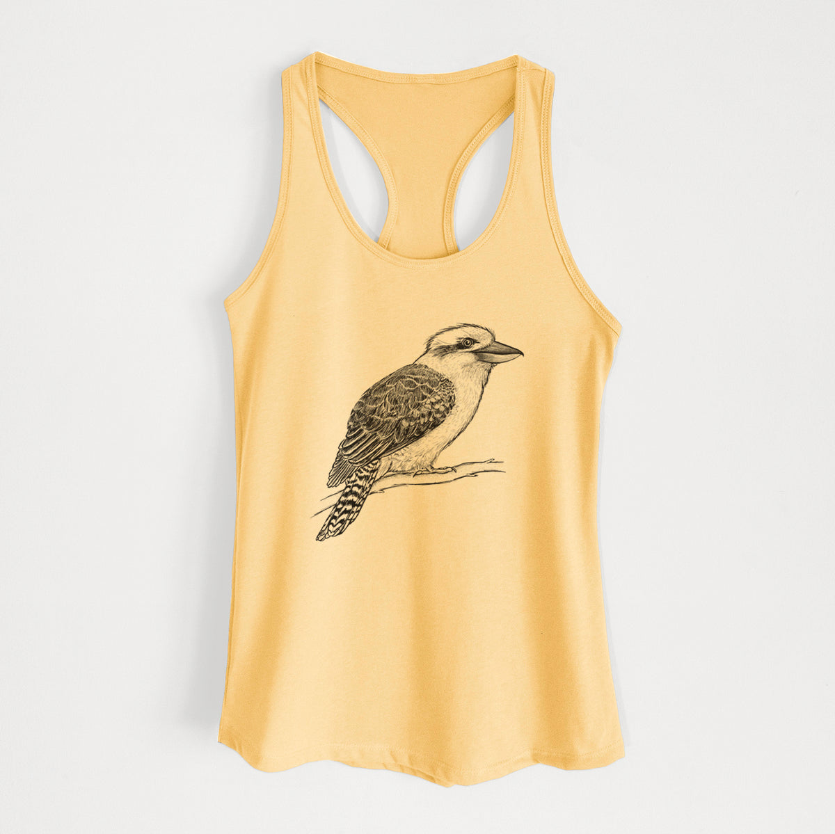 Banana cream women's racerback tank top laid flat, printed with a detailed black ink sketch of a kookaburra perched on a branch.