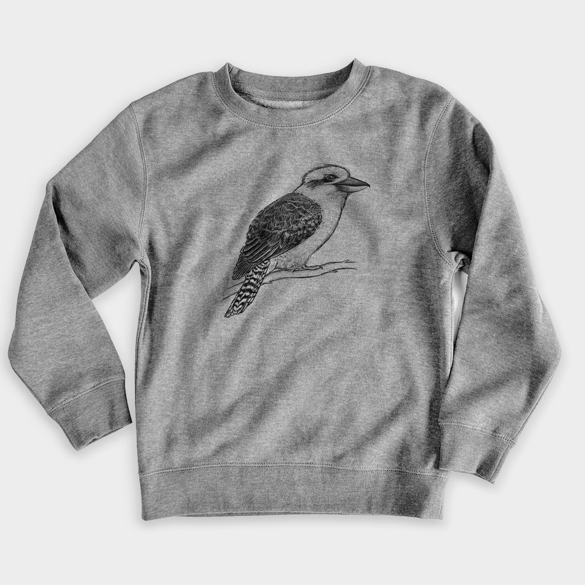 Nickel grey youth crewneck sweatshirt laid flat, printed with a detailed black ink sketch of a kookaburra perched on a branch.
