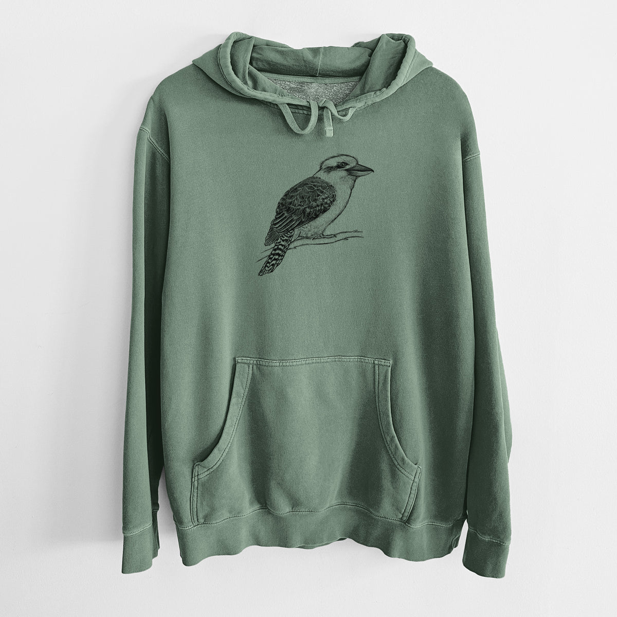 Alpine green pigment dyed hoodie laid flat, printed with a detailed black ink sketch of a kookaburra perched on a branch.