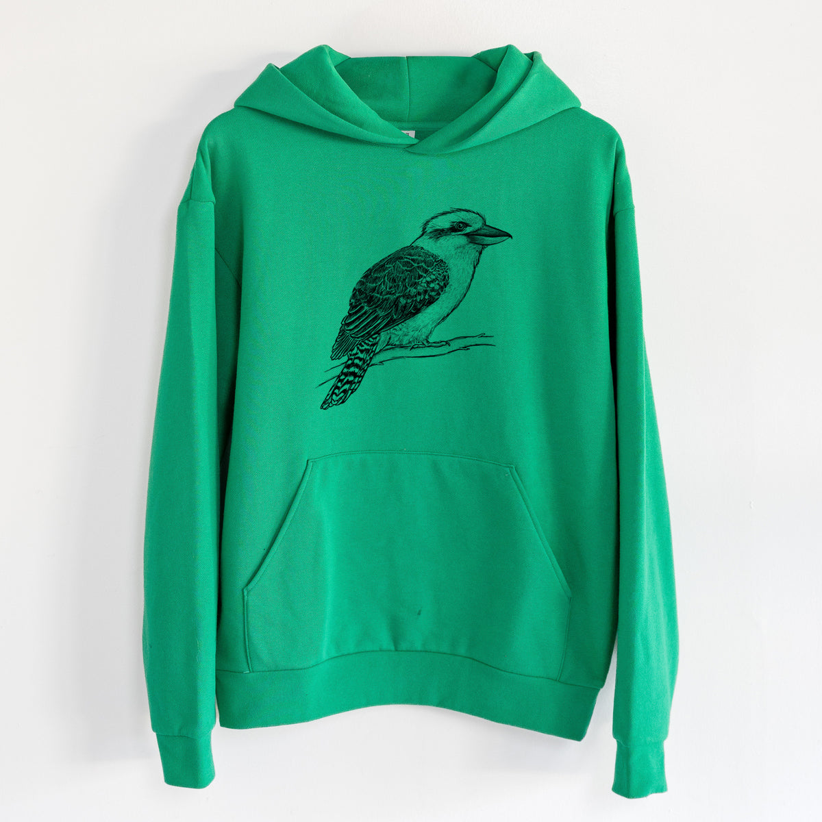 Kookaburra - Dacelo novaeguineae - Statement Midweight Hoodie in Kelly Green, hanging on a white wall, with a front kangaroo pocket and no drawcords.