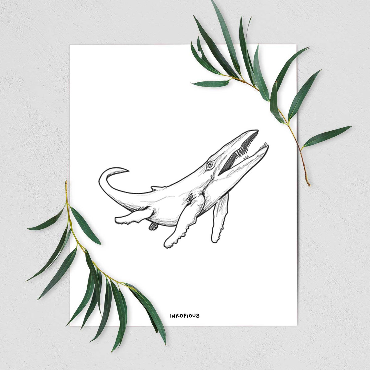 Art print of a black ink illustration of a Kronosaurus marine reptile swimming, shown with eucalyptus leaves.