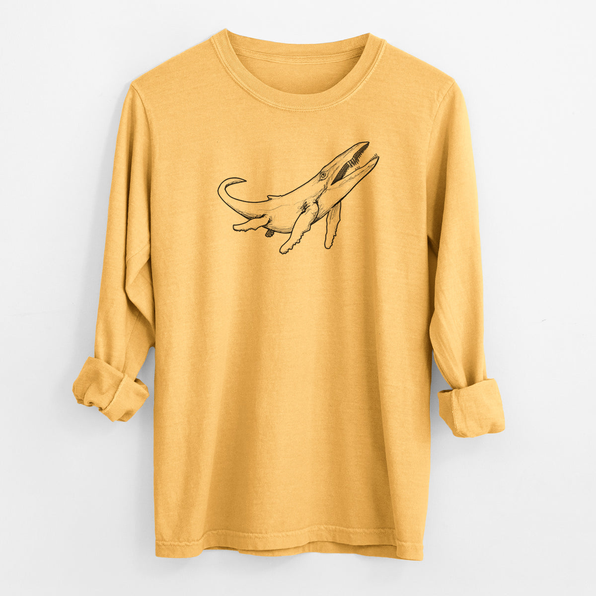 Golden wheat yellow Comfort Colors long sleeve shirt laid flat with the cuffs rolled, printed with a black ink illustration of a Kronosaurus marine reptile swimming.