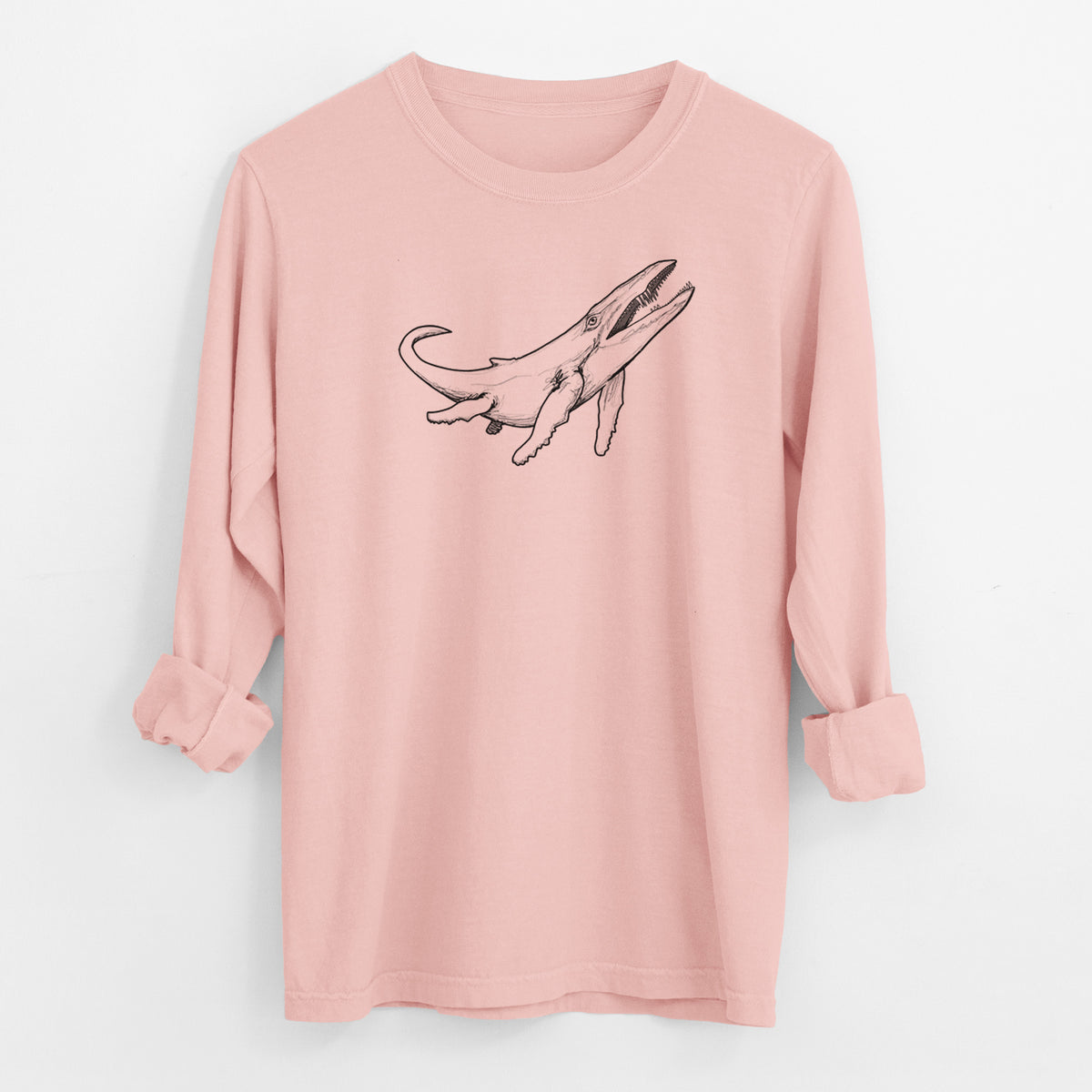 Peachy Comfort Colors long sleeve shirt laid flat with the cuffs rolled, printed with a black ink illustration of a Kronosaurus marine reptile swimming.
