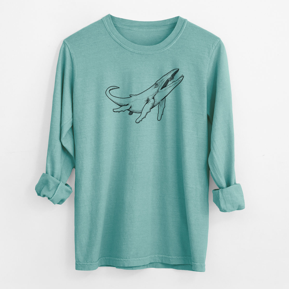 Reef green Comfort Colors long sleeve shirt laid flat with the cuffs rolled, printed with a black ink illustration of a Kronosaurus marine reptile swimming.