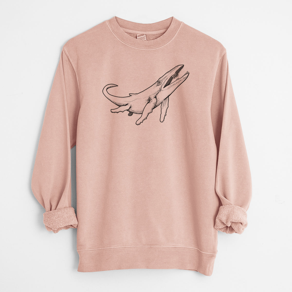 Dusty pink pigment dyed crewneck sweatshirt laid flat with the sleeves rolled, printed with a black ink illustration of a Kronosaurus marine reptile swimming.