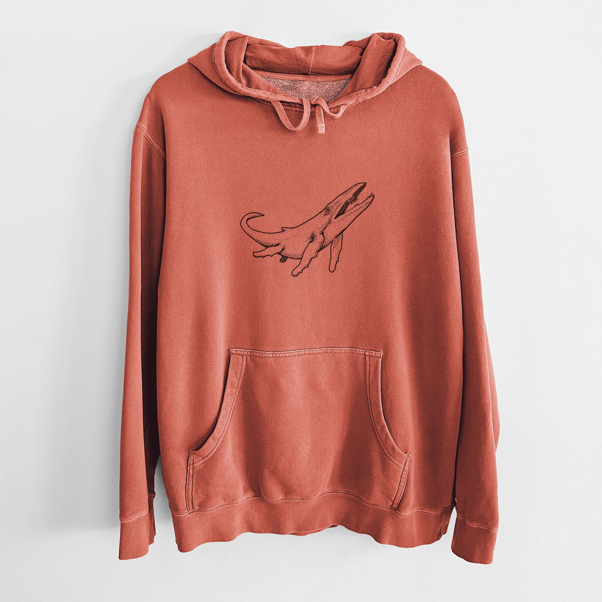 Amber orange pigment dyed hoodie laid flat, printed with a black ink illustration of a Kronosaurus marine reptile swimming.