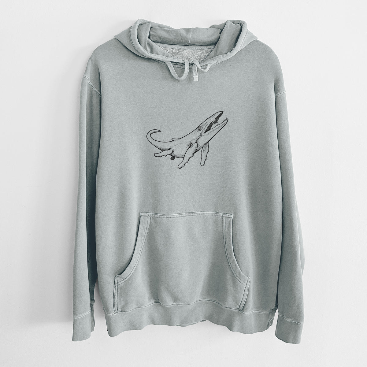 Sage green pigment dyed hoodie laid flat, printed with a black ink illustration of a Kronosaurus marine reptile swimming.