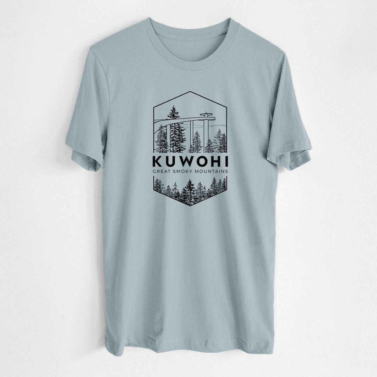Vintage denim lightweight cotton t-shirt laid flat, printed with a black line art badge of the Kuwohi observation tower above pine trees, with the words Kuwohi, Great Smoky Mountains.