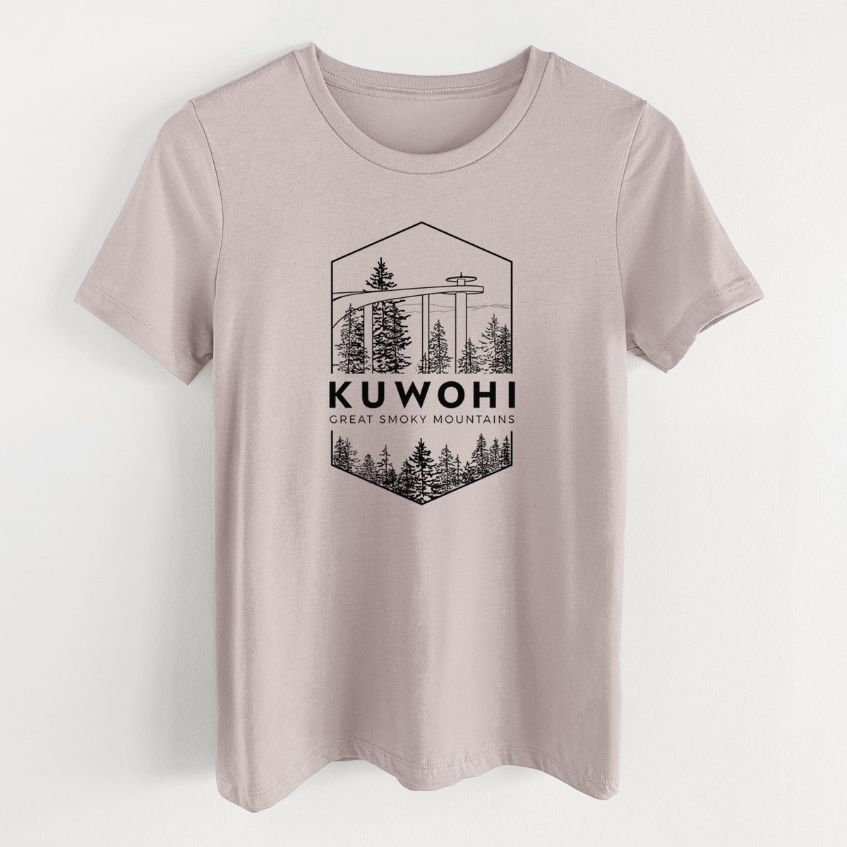 Pink gravel women's relaxed fit cotton t-shirt laid flat, printed with a black line art badge of the Kuwohi observation tower above pine trees, with the words Kuwohi, Great Smoky Mountains.