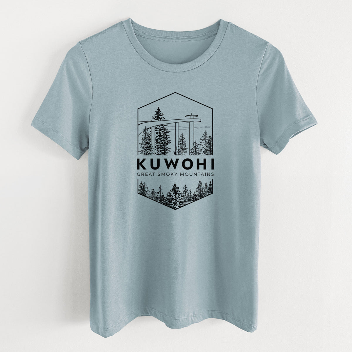 Vintage denim women's relaxed fit cotton t-shirt laid flat, printed with a black line art badge of the Kuwohi observation tower above pine trees, with the words Kuwohi, Great Smoky Mountains.