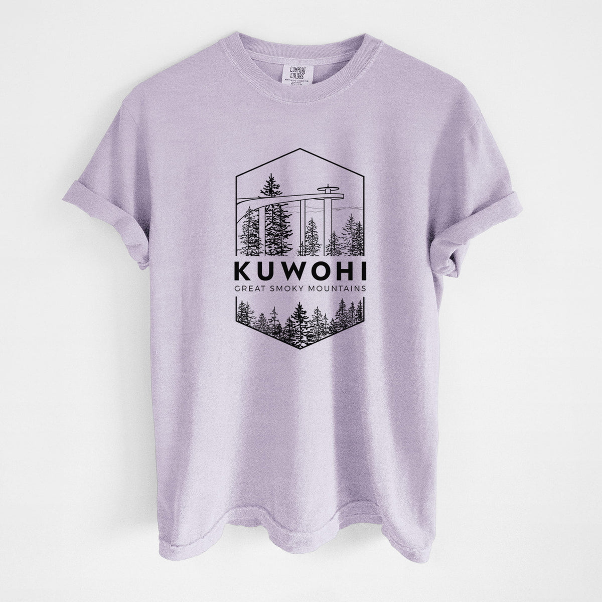 Orchid purple Comfort Colors t-shirt laid flat, printed with a black line art badge of the Kuwohi observation tower above pine trees, with the words Kuwohi, Great Smoky Mountains.