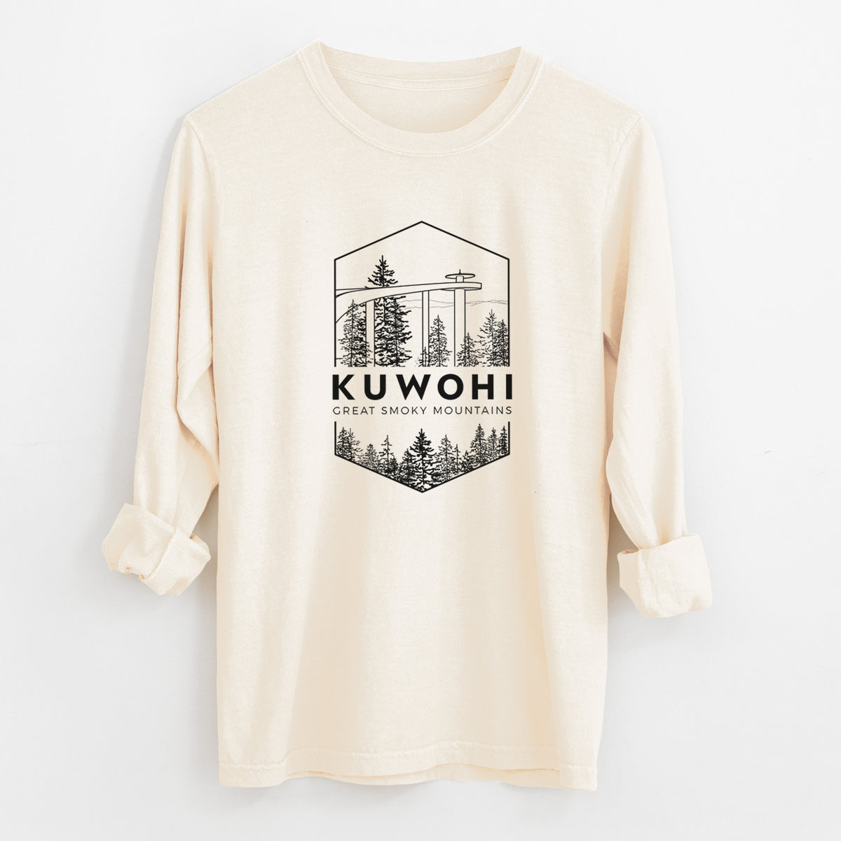 Ivory Comfort Colors long sleeve shirt laid flat with the cuffs rolled, printed with a black line art badge of the Kuwohi observation tower above pine trees, with the words Kuwohi, Great Smoky Mountains.