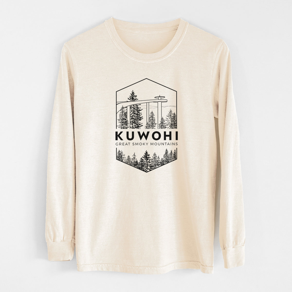 Ivory Comfort Colors long sleeve shirt laid flat, printed with a black line art badge of the Kuwohi observation tower above pine trees, with the words Kuwohi, Great Smoky Mountains.