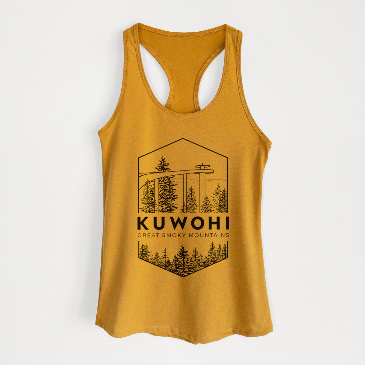 Gold women's racerback tank top laid flat, printed with a black line art badge of the Kuwohi observation tower above pine trees, with the words Kuwohi, Great Smoky Mountains.