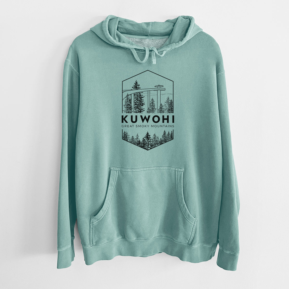 Mint green pigment dyed hoodie laid flat, printed with a black line art badge of the Kuwohi observation tower above pine trees, with the words Kuwohi, Great Smoky Mountains.