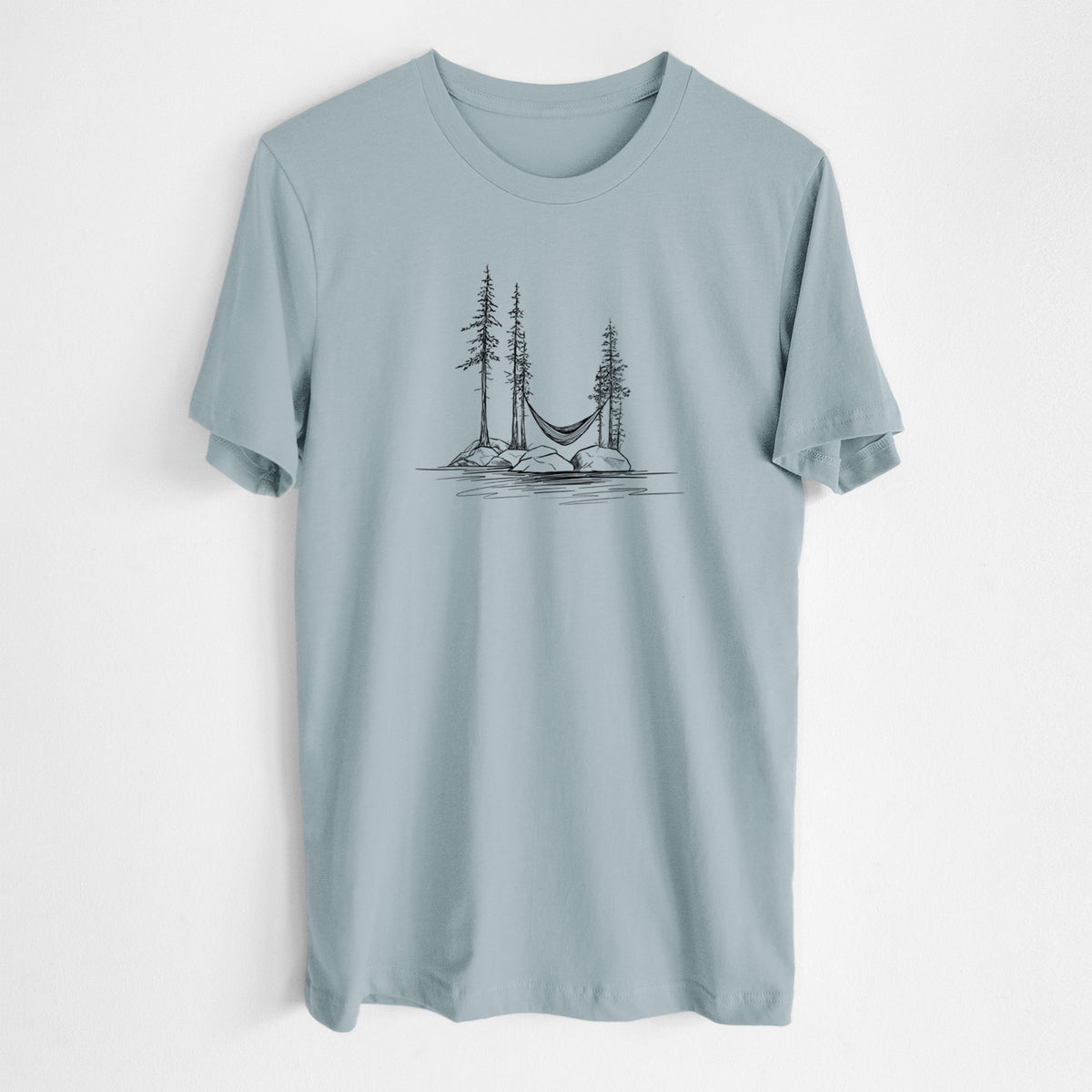 Vintage denim lightweight cotton t-shirt laid flat, printed with a black ink illustration of a hammock strung between pine trees on a small lakeside island.