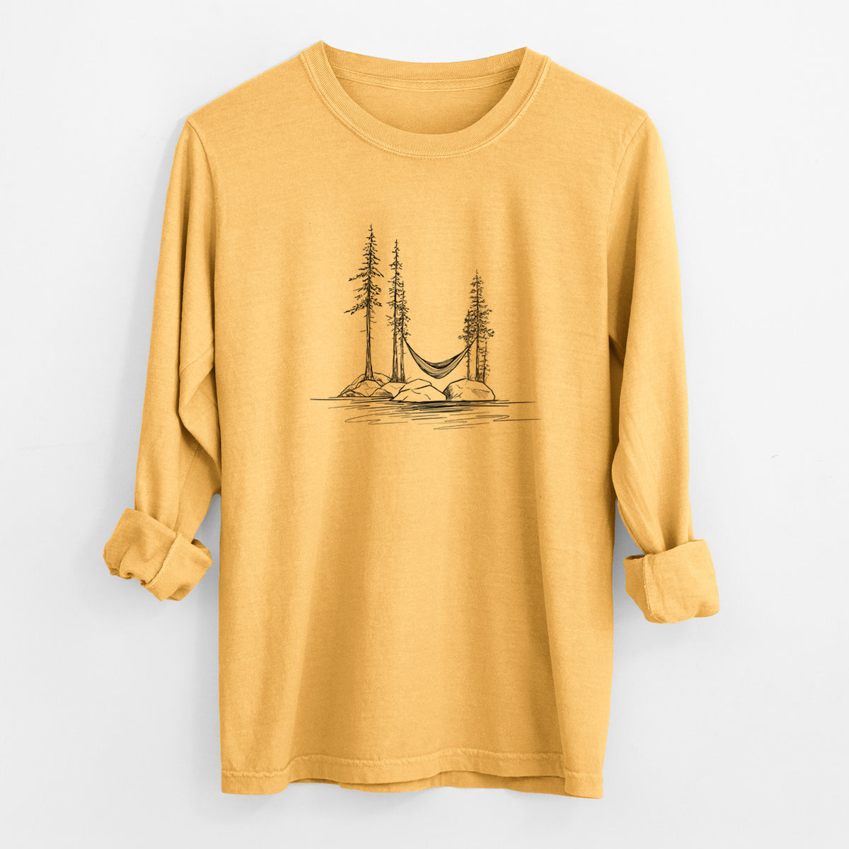 Golden wheat yellow Comfort Colors long sleeve shirt laid flat with the cuffs rolled, printed with a black ink illustration of a hammock strung between pine trees on a small lakeside island.