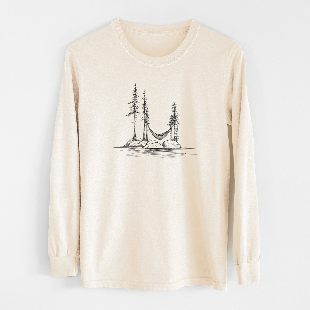 Ivory Comfort Colors long sleeve shirt laid flat, printed with a black ink illustration of a hammock strung between pine trees on a small lakeside island.