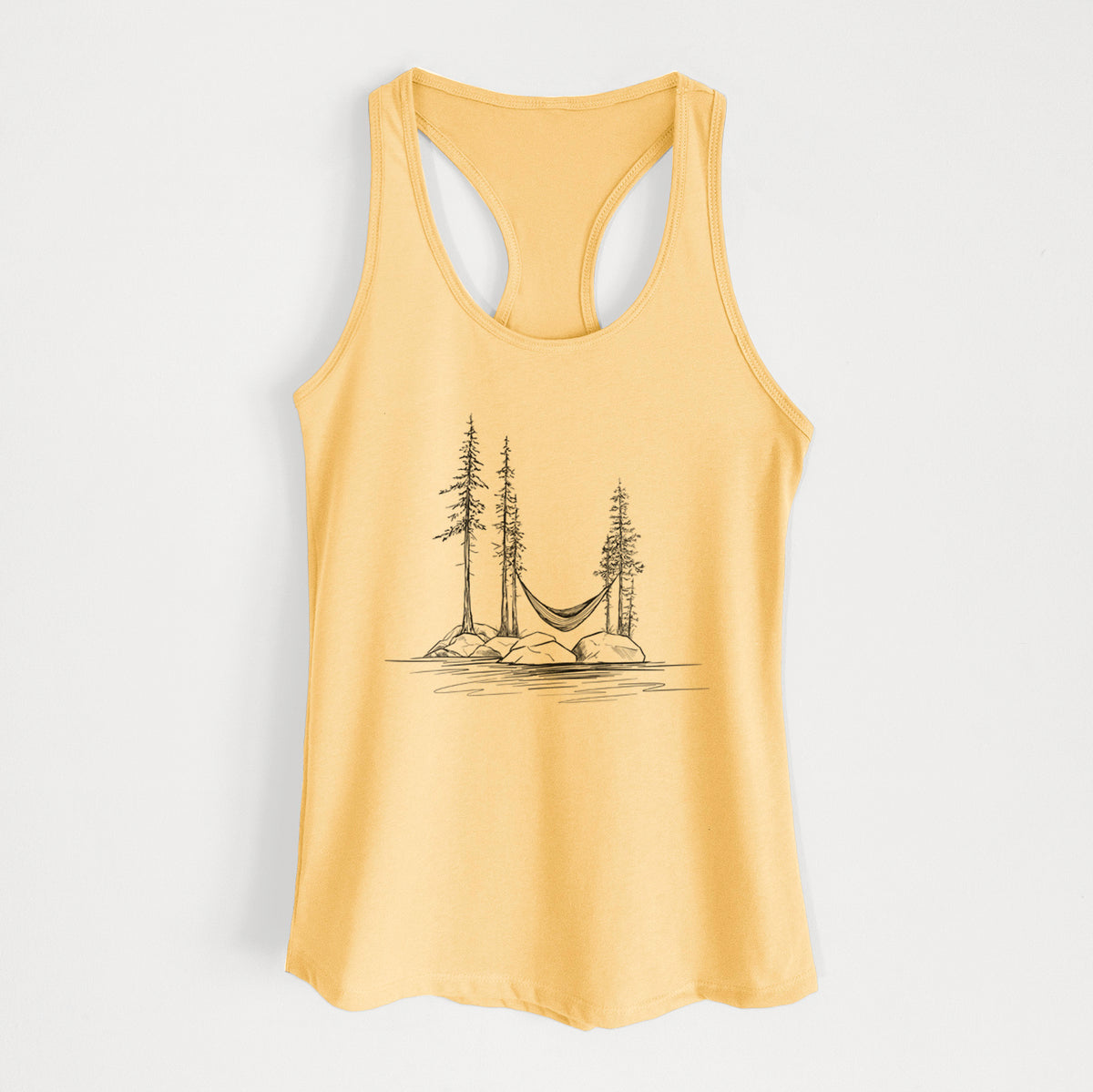Banana cream women's racerback tank top laid flat, printed with a black ink illustration of a hammock strung between pine trees on a small lakeside island.