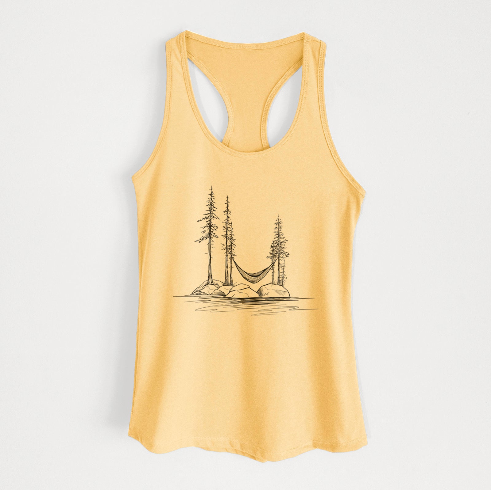 Banana cream women's racerback tank top laid flat, printed with a black ink illustration of a hammock strung between pine trees on a small lakeside island.