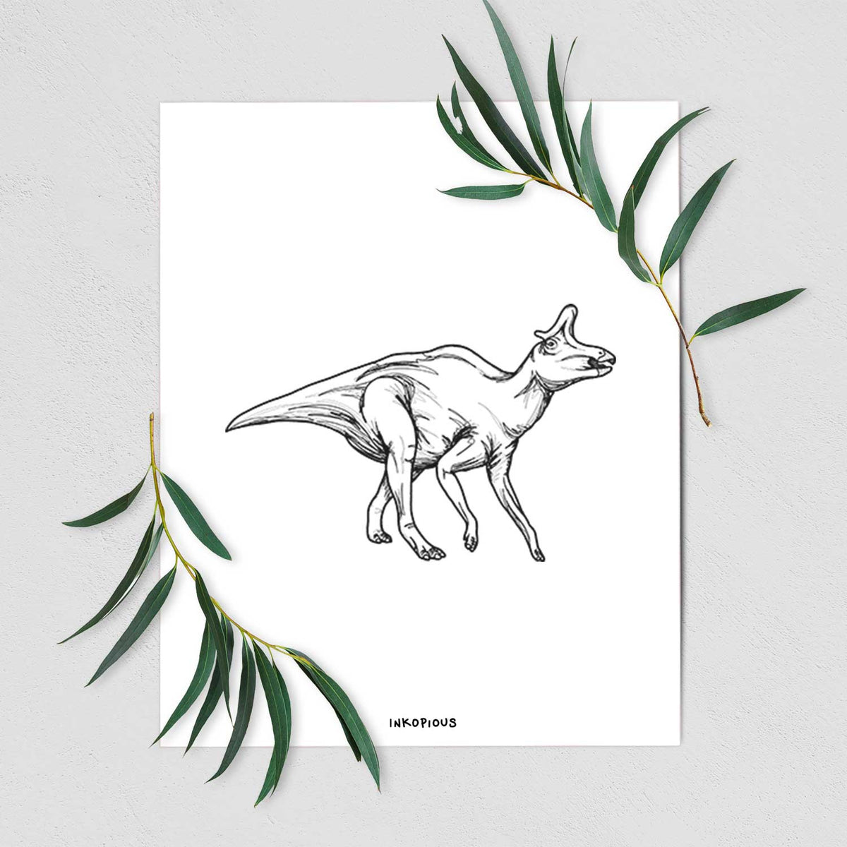Art print of a black ink illustration of a crested Lambeosaurus walking, shown with eucalyptus leaves.
