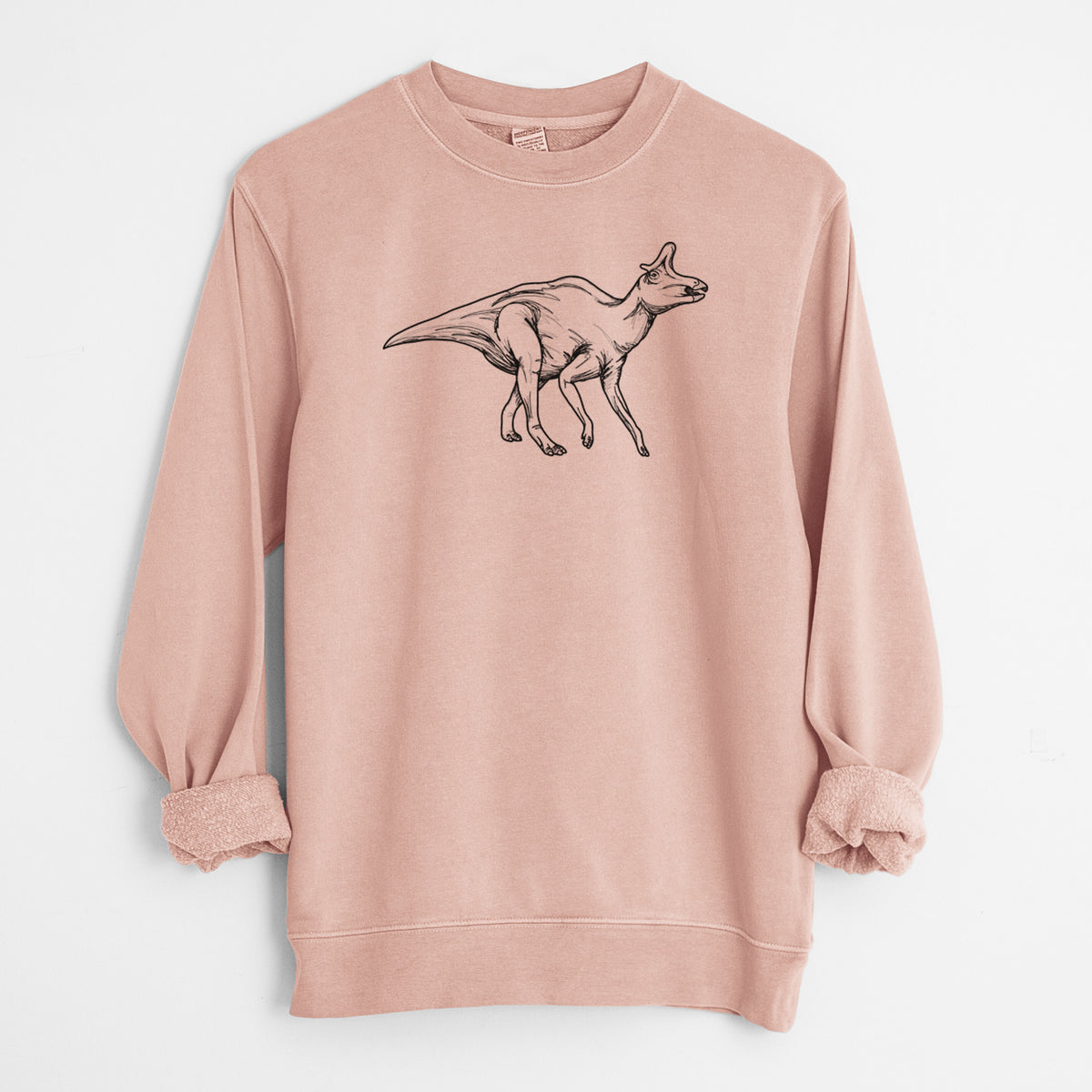 Dusty pink pigment dyed crewneck sweatshirt laid flat with the sleeves rolled, printed with a black ink illustration of a crested Lambeosaurus walking.