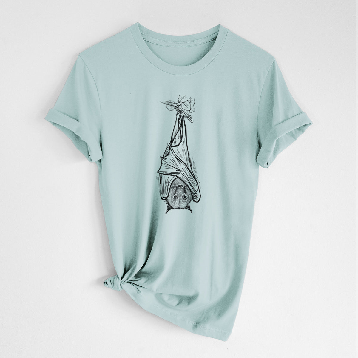 Dusty blue lightweight cotton t-shirt laid flat with the sleeves rolled, printed with a black ink illustration of a large flying fox bat hanging upside down with its wings wrapped around it.