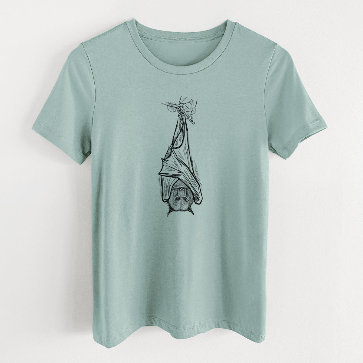 Dusty blue women's relaxed fit cotton t-shirt laid flat, printed with a black ink illustration of a large flying fox bat hanging upside down with its wings wrapped around it.
