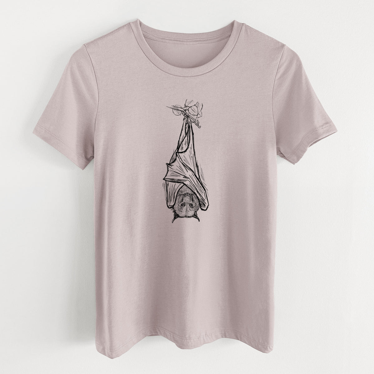 Pink gravel women's relaxed fit cotton t-shirt laid flat, printed with a black ink illustration of a large flying fox bat hanging upside down with its wings wrapped around it.