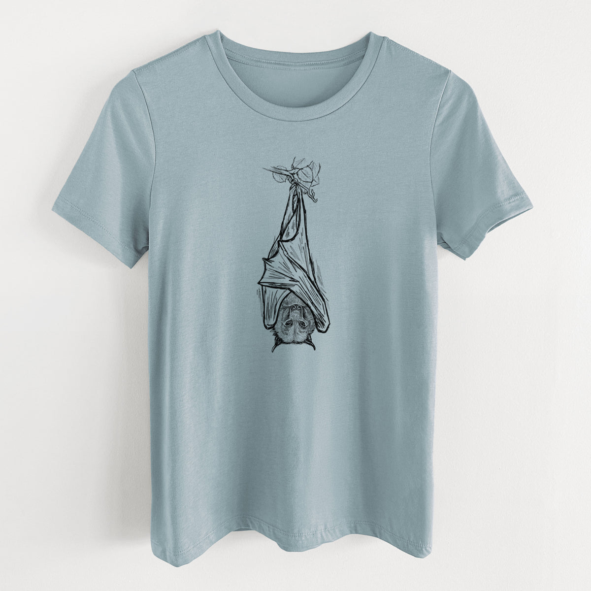 Vintage denim women's relaxed fit cotton t-shirt laid flat, printed with a black ink illustration of a large flying fox bat hanging upside down with its wings wrapped around it.